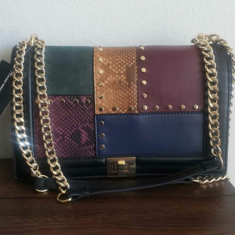International concept handbag bag multicolored patches.
